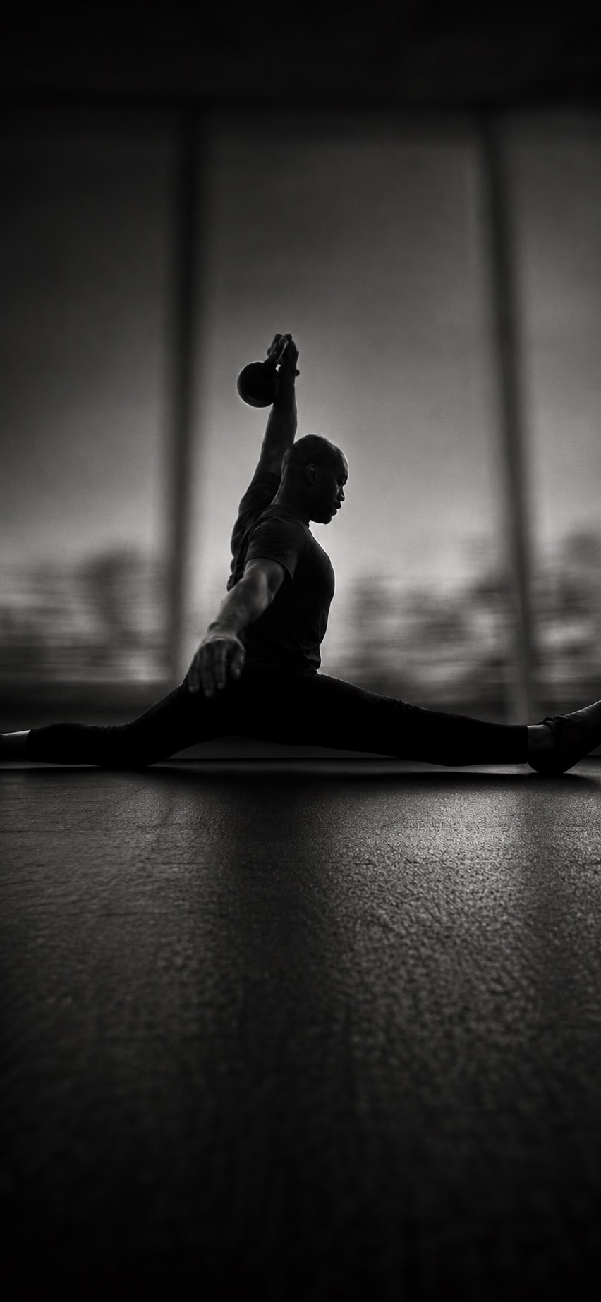 Athlete demonstrating a weighted front split